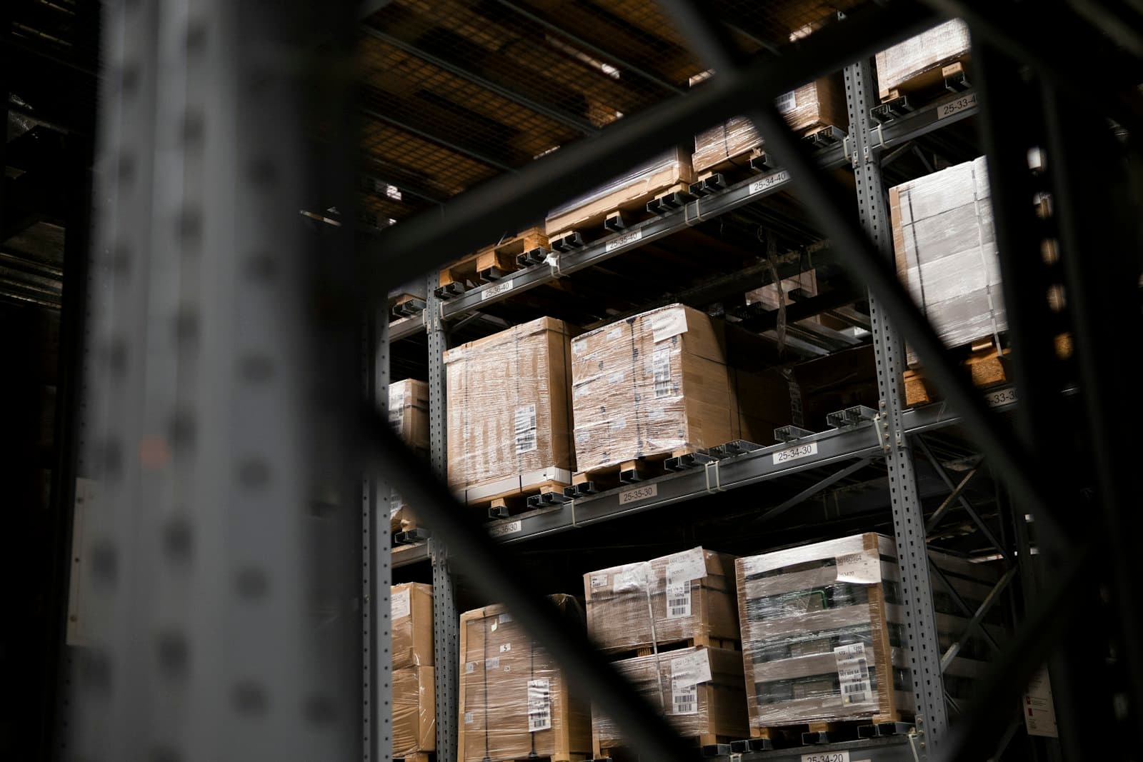 Pallet racking stacked with boxed inventory in a warehouse